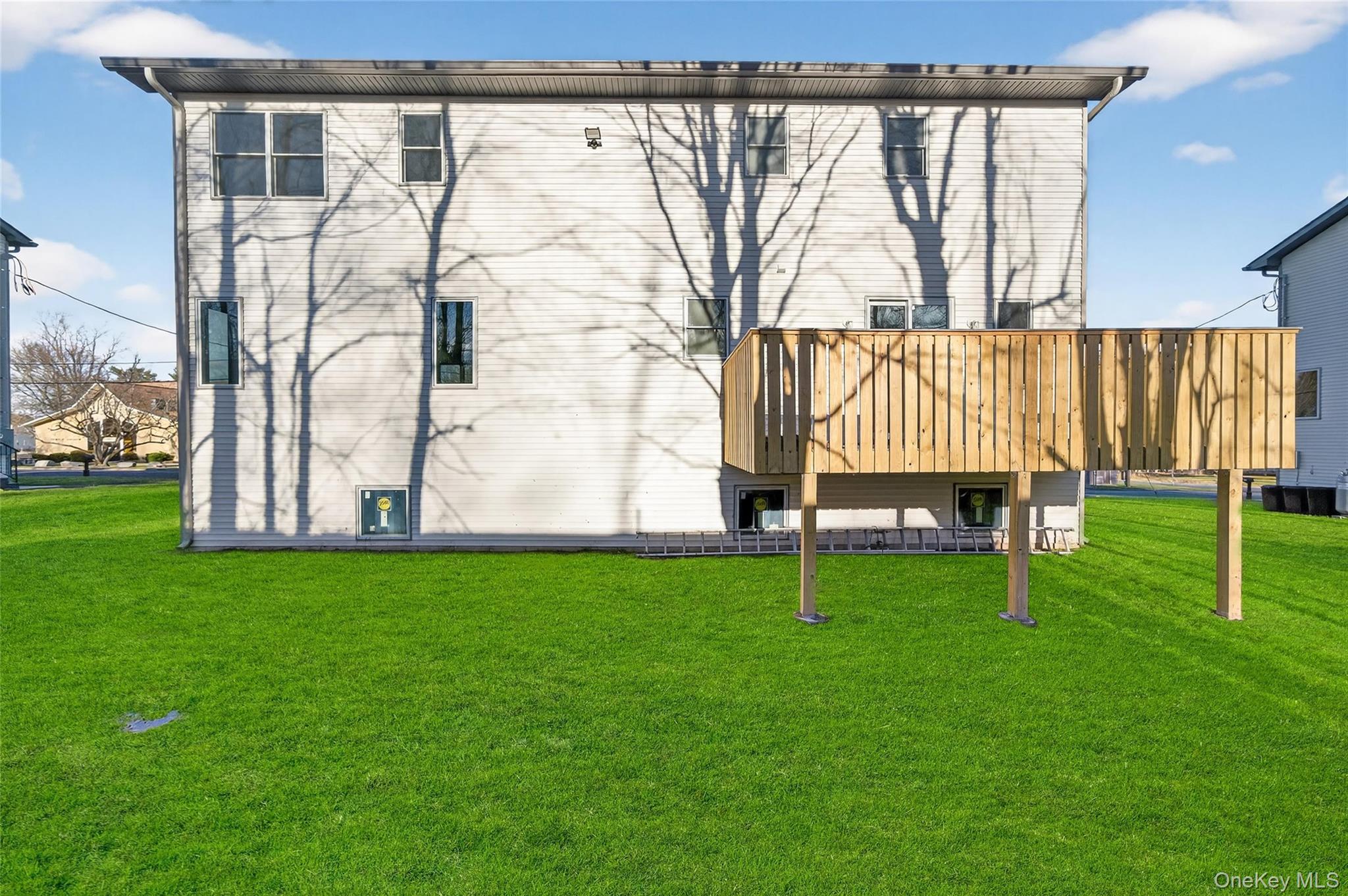 14 East Dillon Road Monticello, NY 12701 - Photo 34 of 50 Back of house featuring a yard and a wooden deck