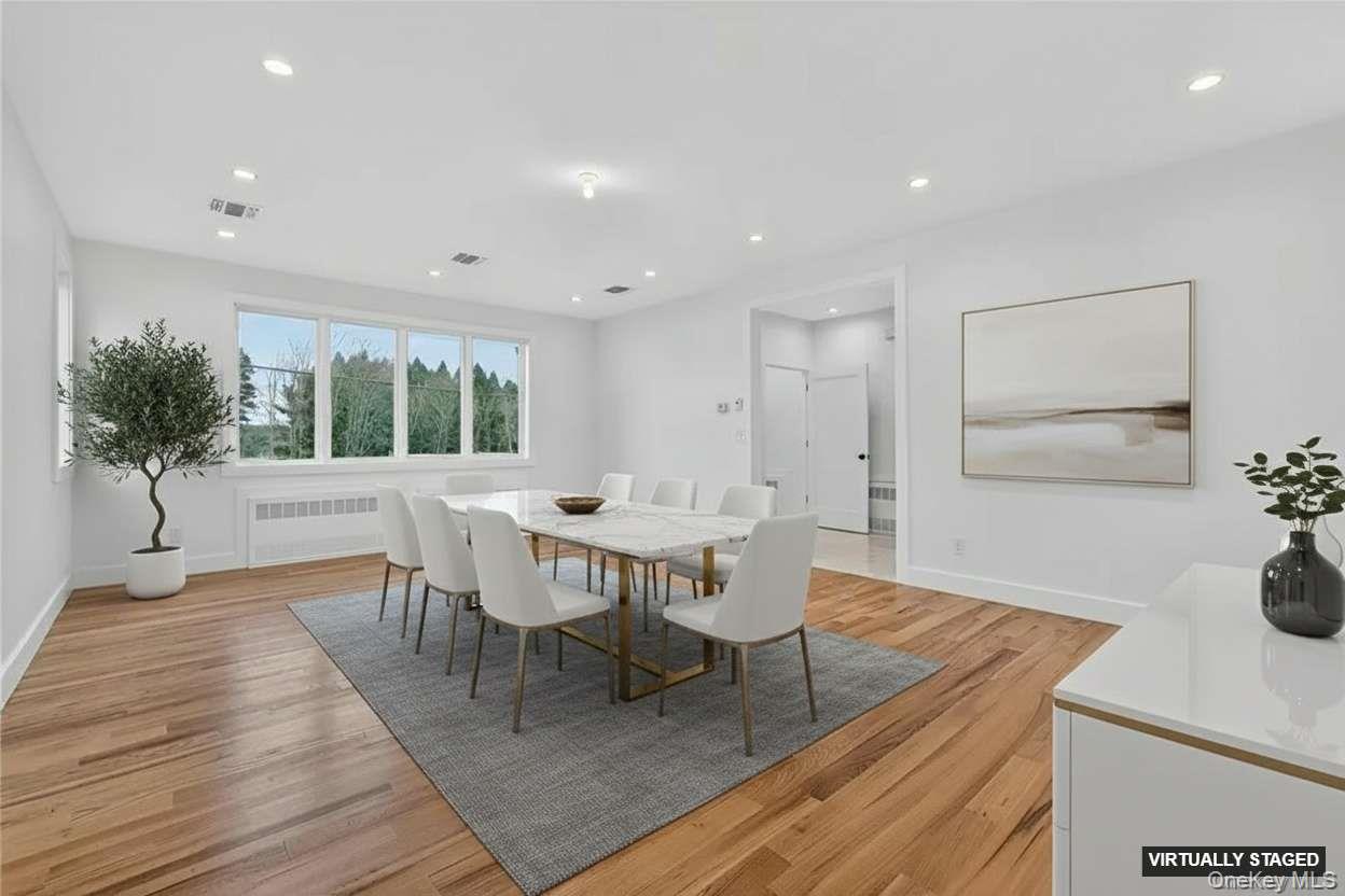 14 East Dillon Road Monticello, NY 12701 - Photo 7 of 50 Dining space with light wood finished floors, radiator heating unit, and recessed lighting