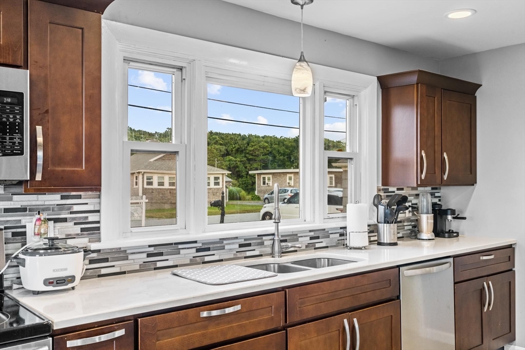 10 Silver Shell Beach Drive Fairhaven, MA 02719 - Photo 12 of 41 a kitchen with a sink stove and cabinets