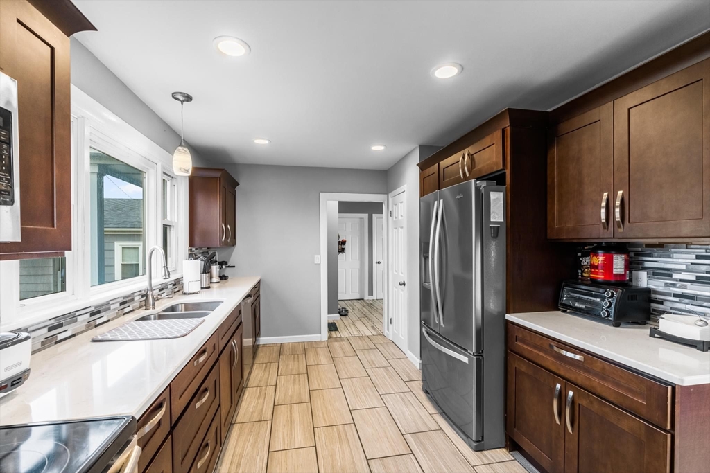 10 Silver Shell Beach Drive Fairhaven, MA 02719 - Photo 13 of 41 a kitchen with stainless steel appliances a sink stove and refrigerator