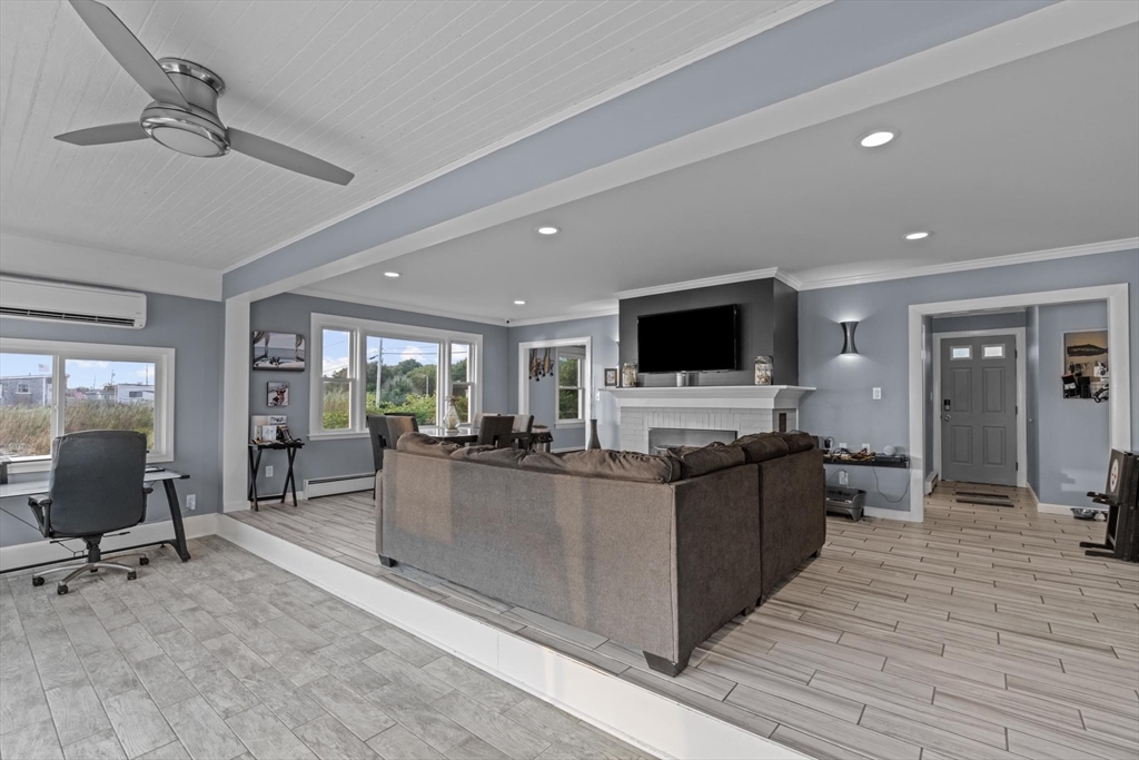 10 Silver Shell Beach Drive Fairhaven, MA 02719 - Photo 14 of 41 a view of a living room kitchen and a wooden floor