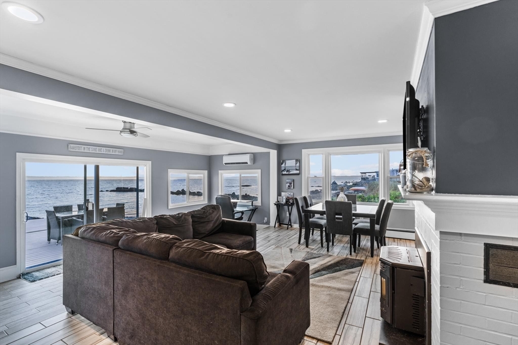 10 Silver Shell Beach Drive Fairhaven, MA 02719 - Photo 15 of 41 a living room with furniture and large windows