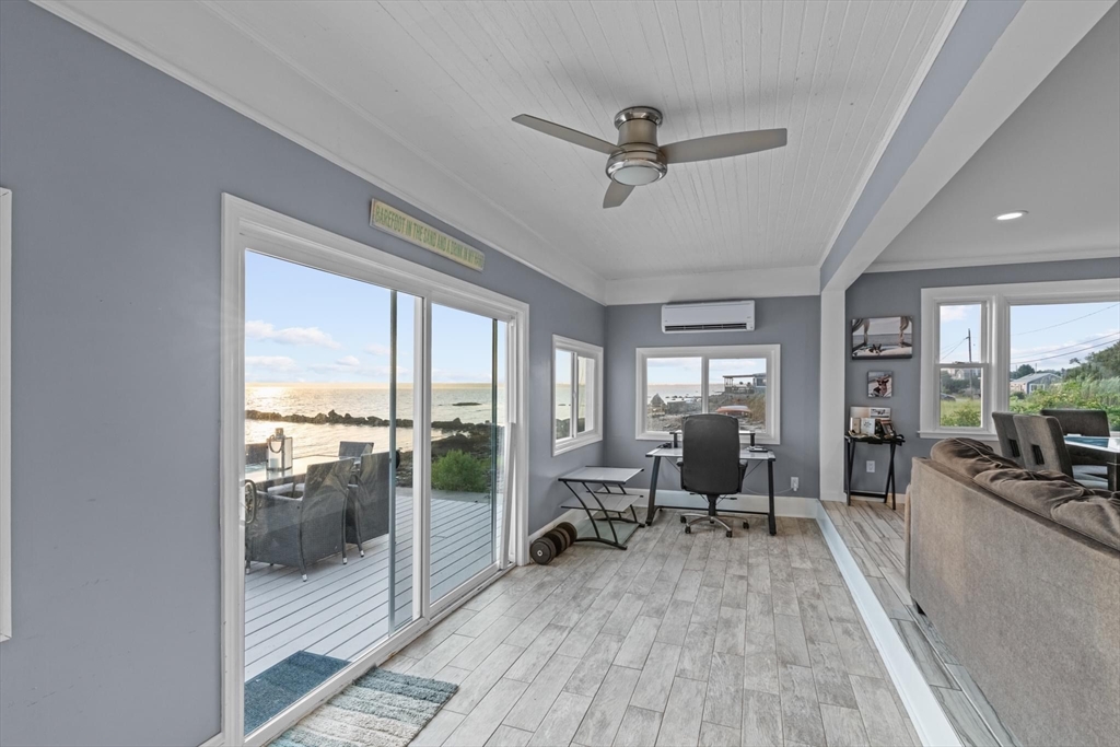10 Silver Shell Beach Drive Fairhaven, MA 02719 - Photo 18 of 41 a view of a livingroom with lounge chair and windows