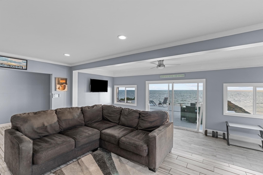 10 Silver Shell Beach Drive Fairhaven, MA 02719 - Photo 19 of 41 a living room with furniture and a flat screen tv