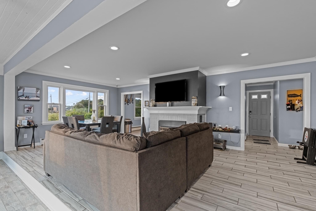10 Silver Shell Beach Drive Fairhaven, MA 02719 - Photo 22 of 41 a living room with furniture and a flat screen tv