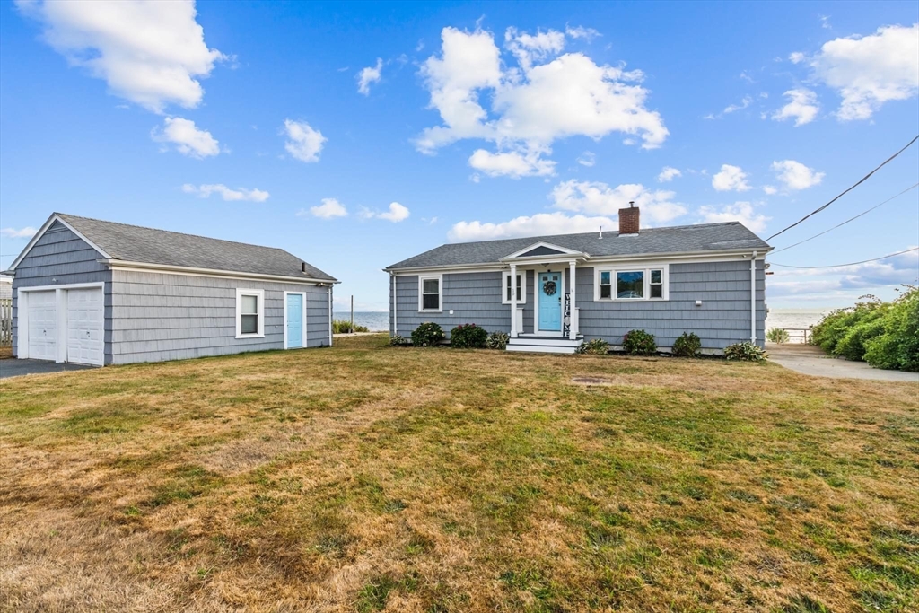 10 Silver Shell Beach Drive Fairhaven, MA 02719 - Photo 41 of 41 a front view of a house with a garden