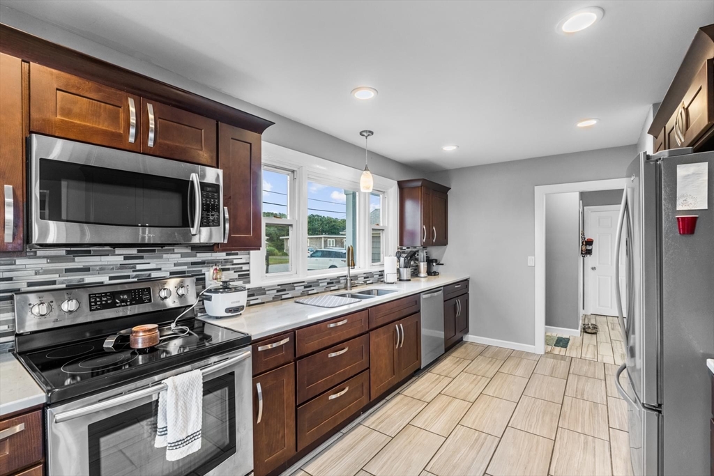 10 Silver Shell Beach Drive Fairhaven, MA 02719 - Photo 9 of 41 a kitchen with a sink stove and microwave