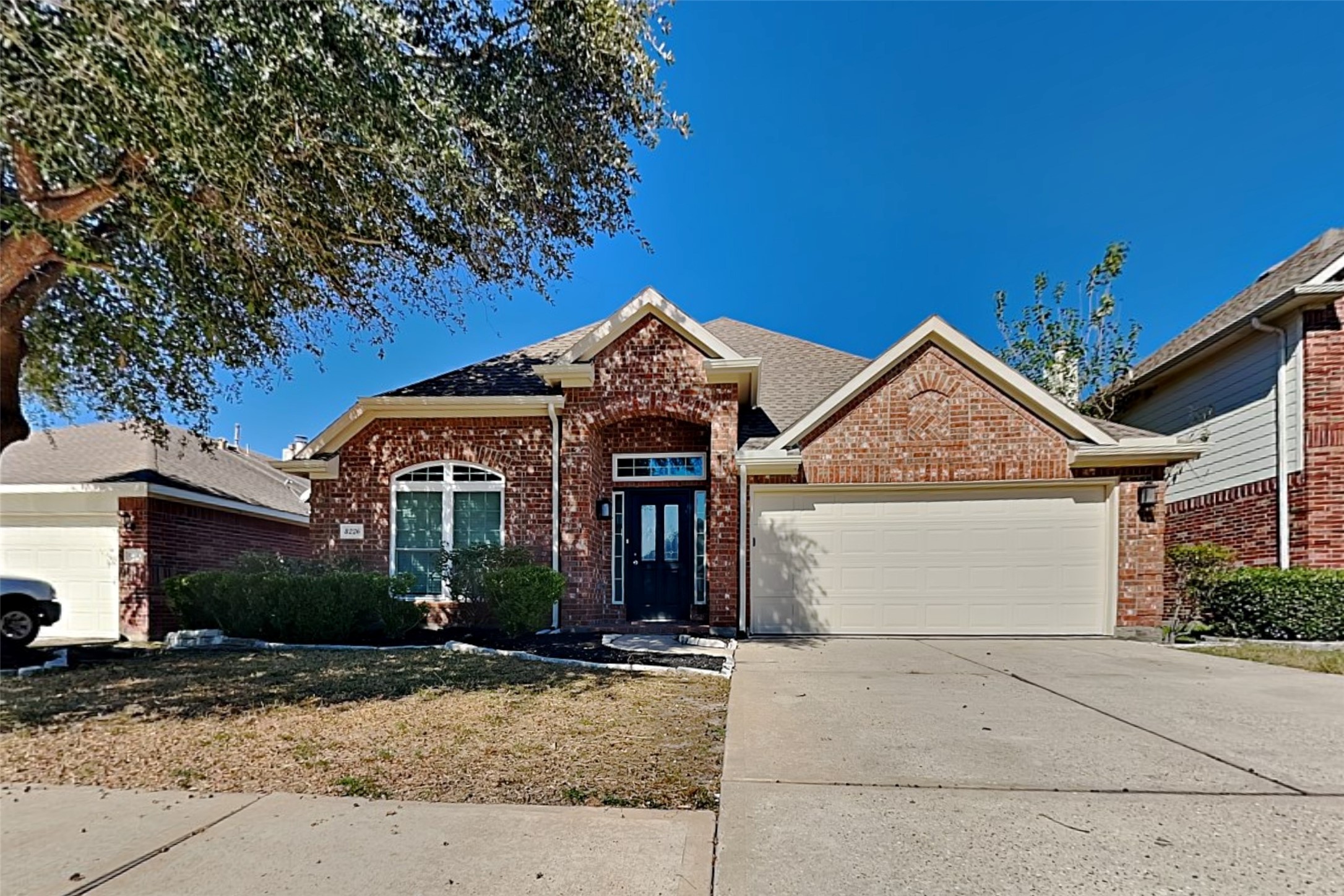 8226 Point Pendleton Drive Tomball, TX 77375 - Photo 1 of 19 a front view of a house with a yard and garage