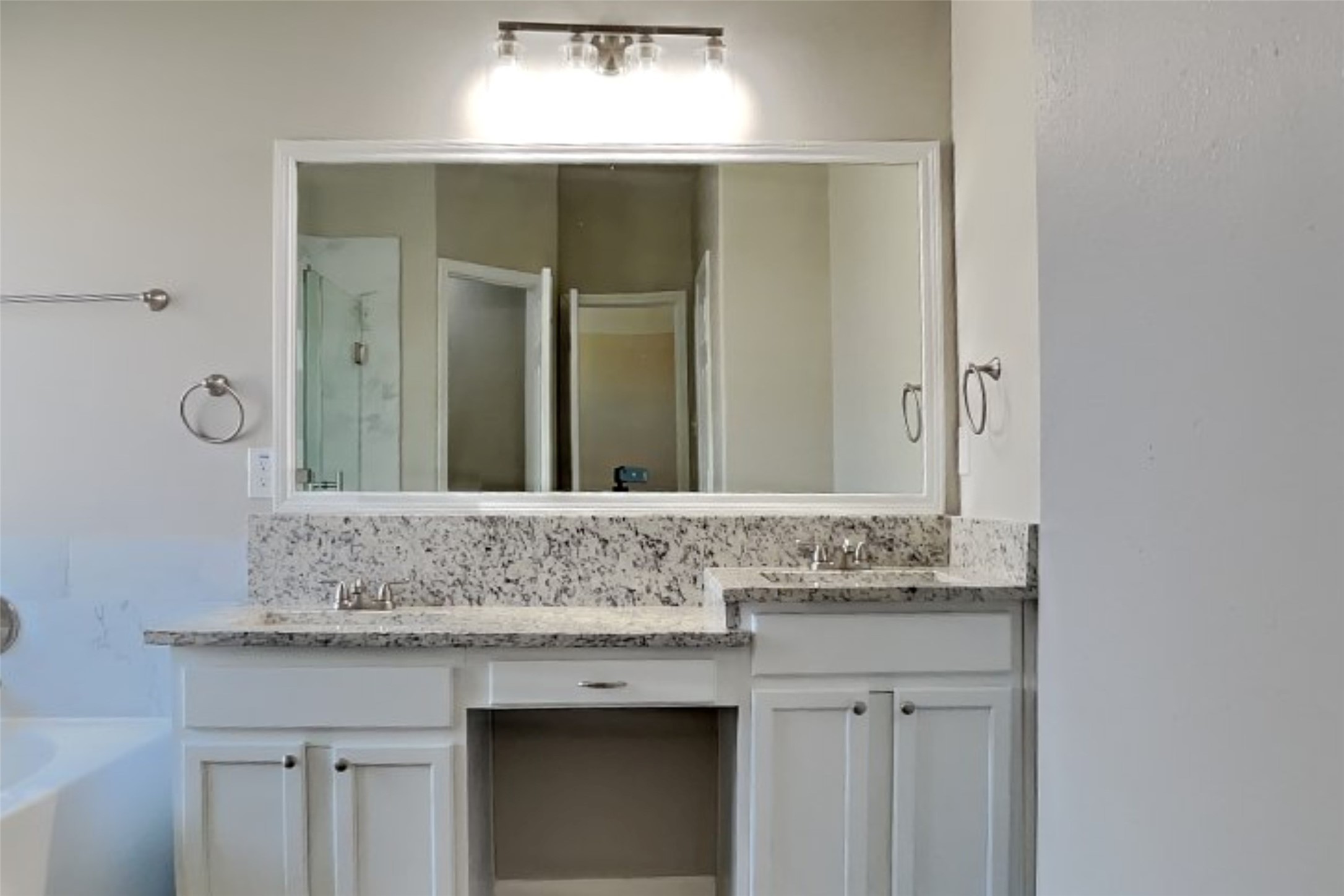 8226 Point Pendleton Drive Tomball, TX 77375 - Photo 11 of 19 a bathroom with a granite countertop sink and a mirror