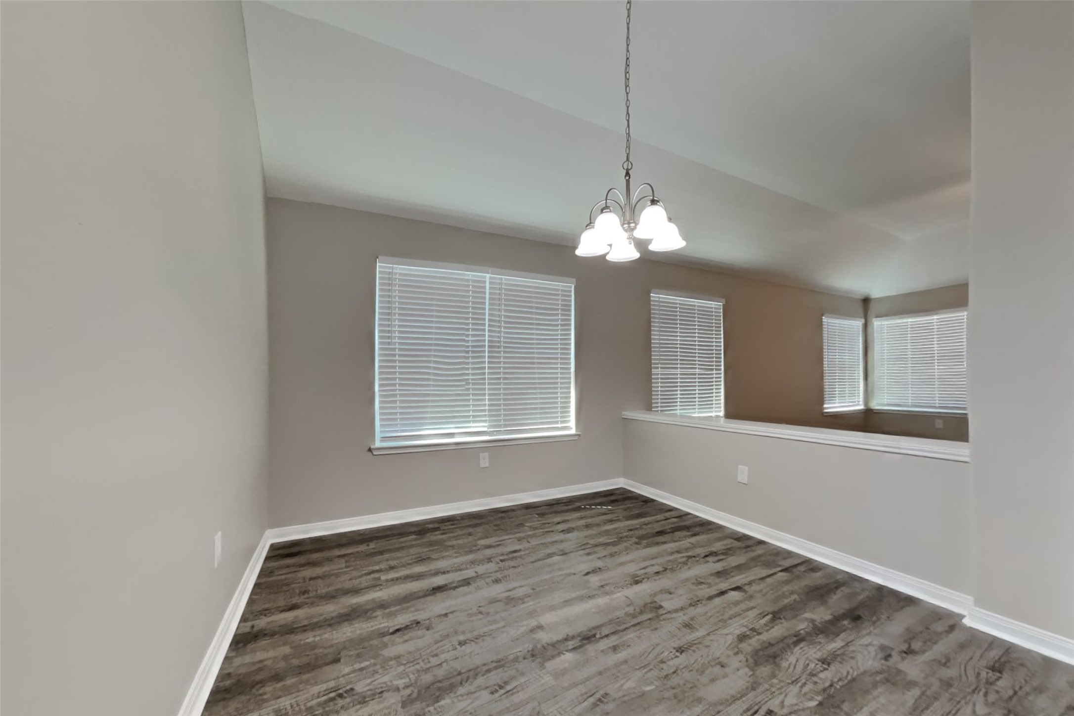 8226 Point Pendleton Drive Tomball, TX 77375 - Photo 9 of 19 an empty room with wooden floor and windows