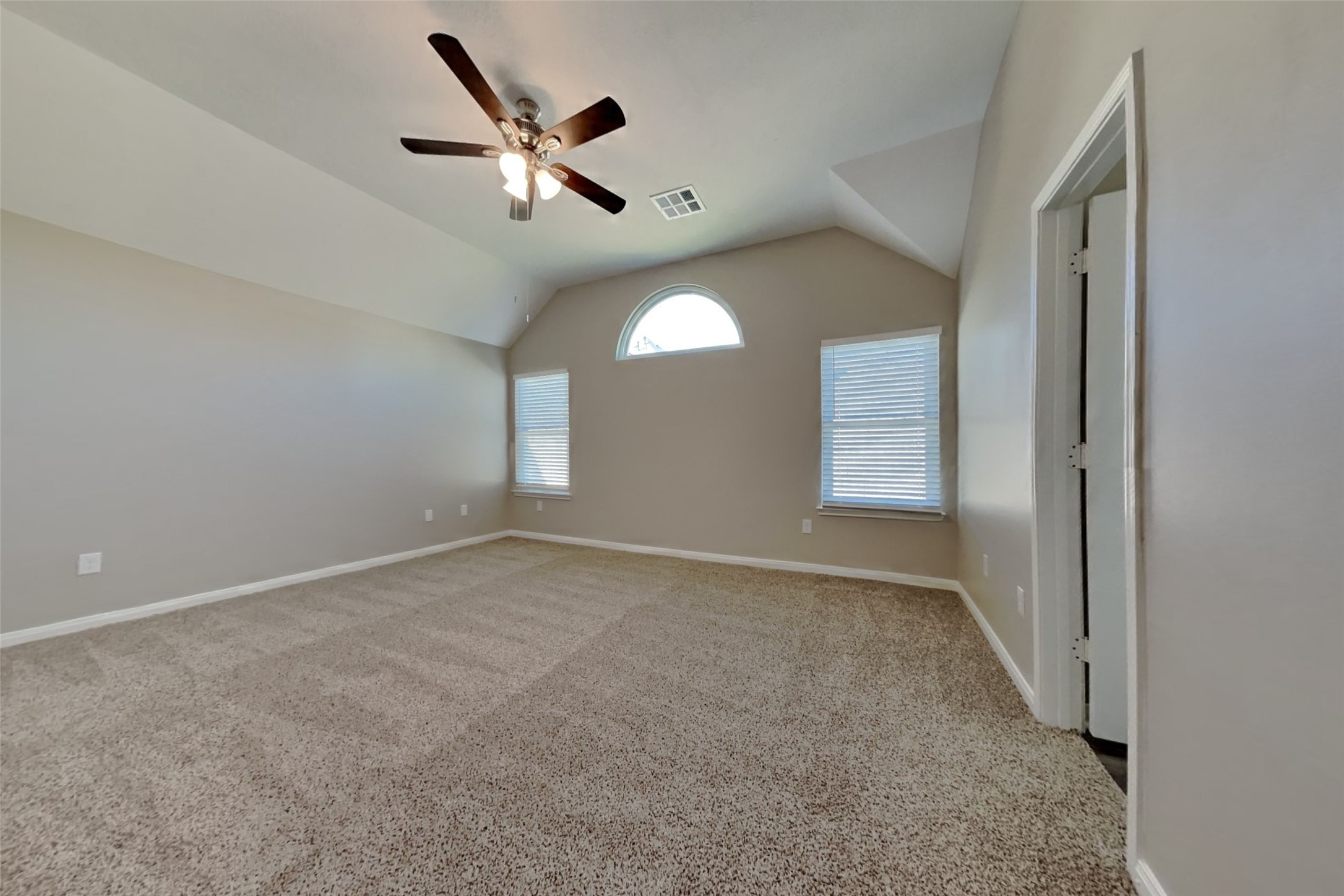8226 Point Pendleton Drive Tomball, TX 77375 - Photo 10 of 19 an empty room with ceiling fan and windows