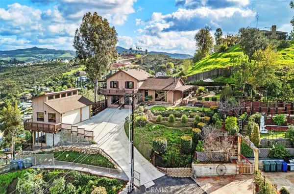 a view of a garden with a house