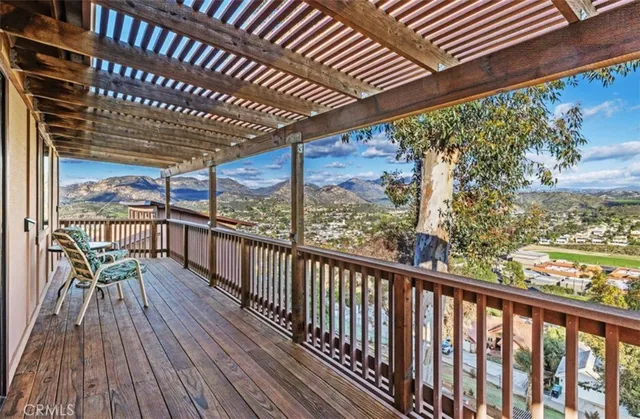 a view of a balcony with furniture