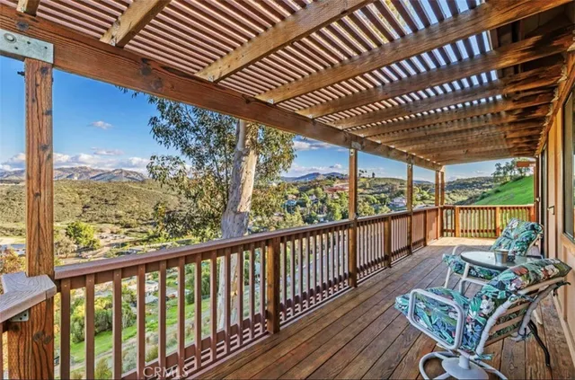 a view of a chairs in wooden deck