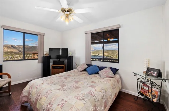 a bedroom with a bed and a tv