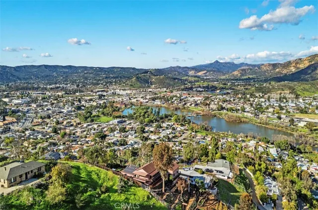 an aerial view of residential building and lake