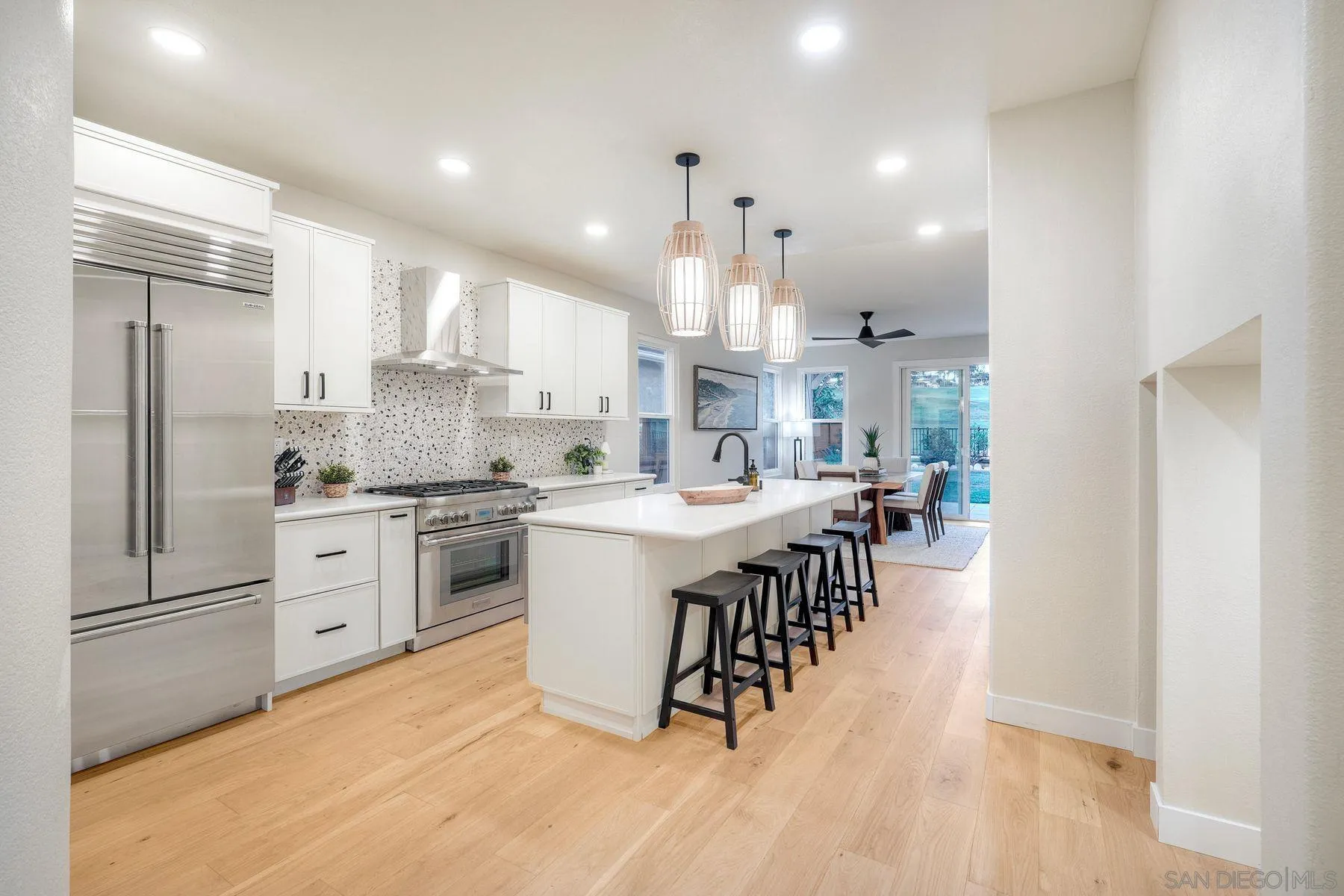 529 Peach Tree Way San Marcos, CA 92069 - Photo 7 of 30 a kitchen with white cabinets and stainless steel appliances