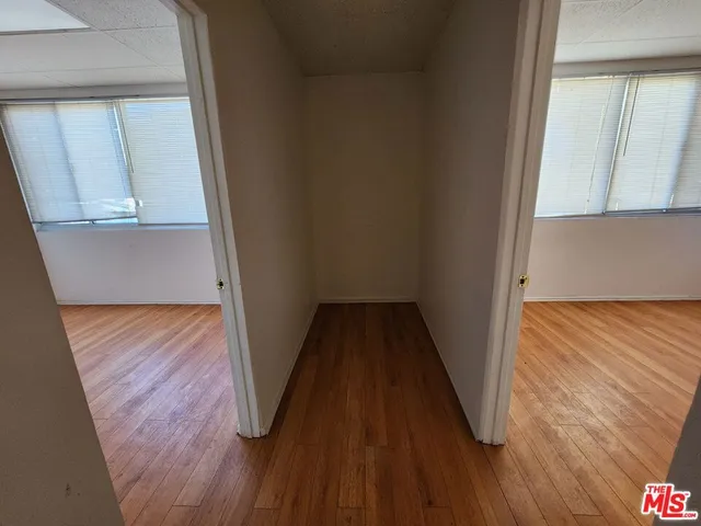 a view of balcony with wooden floor