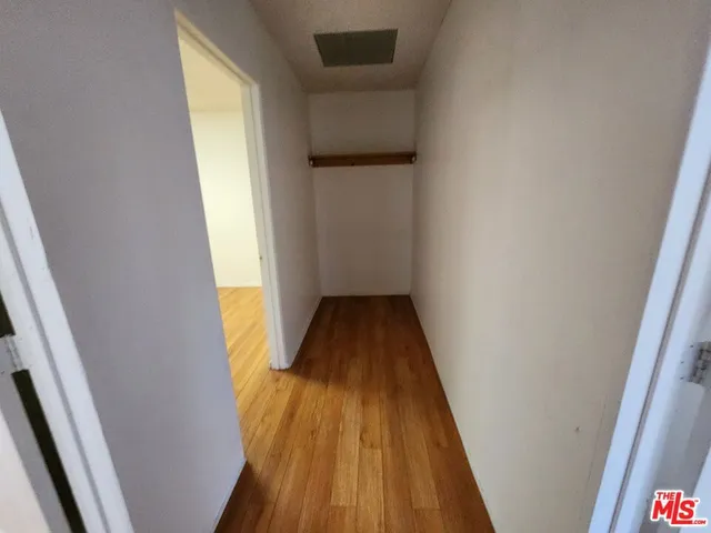 a view of a white building with a outdoor space