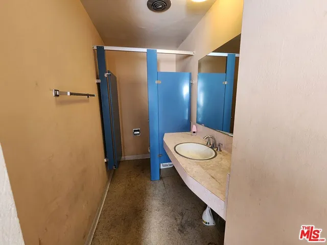 a front view of a house with iron fence