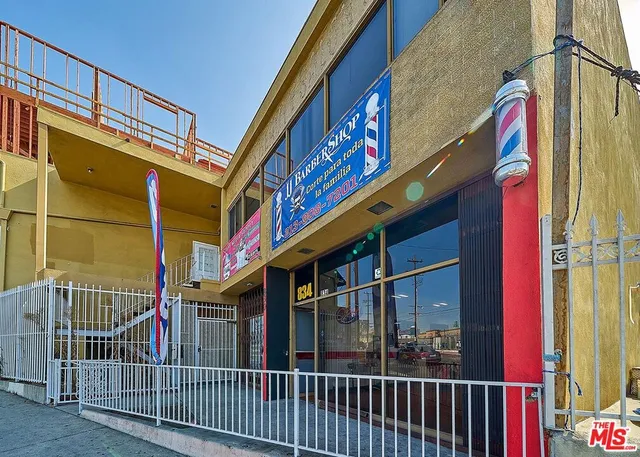 a living room with furniture and a dining area