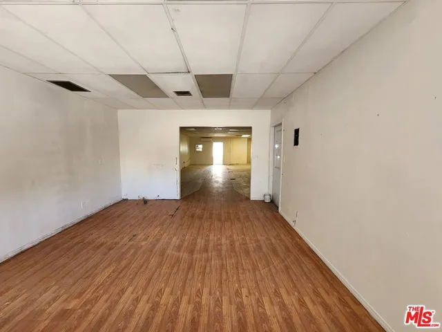 a kitchen with stainless steel appliances a stove a sink and a microwave