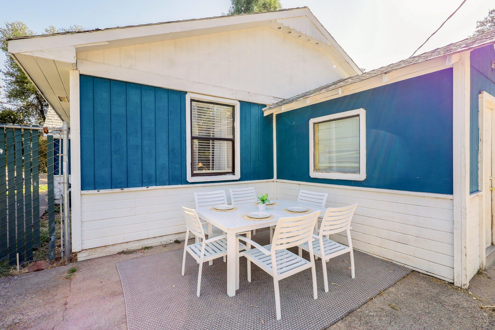 7699 Happy Valley Road Anderson, CA 96007 - Photo 11 of 49 a dinning table and chair in front of a door