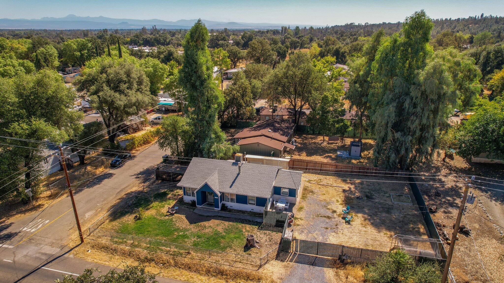 7699 Happy Valley Road Anderson, CA 96007 - Photo 16 of 49 an aerial view of a house with a yard