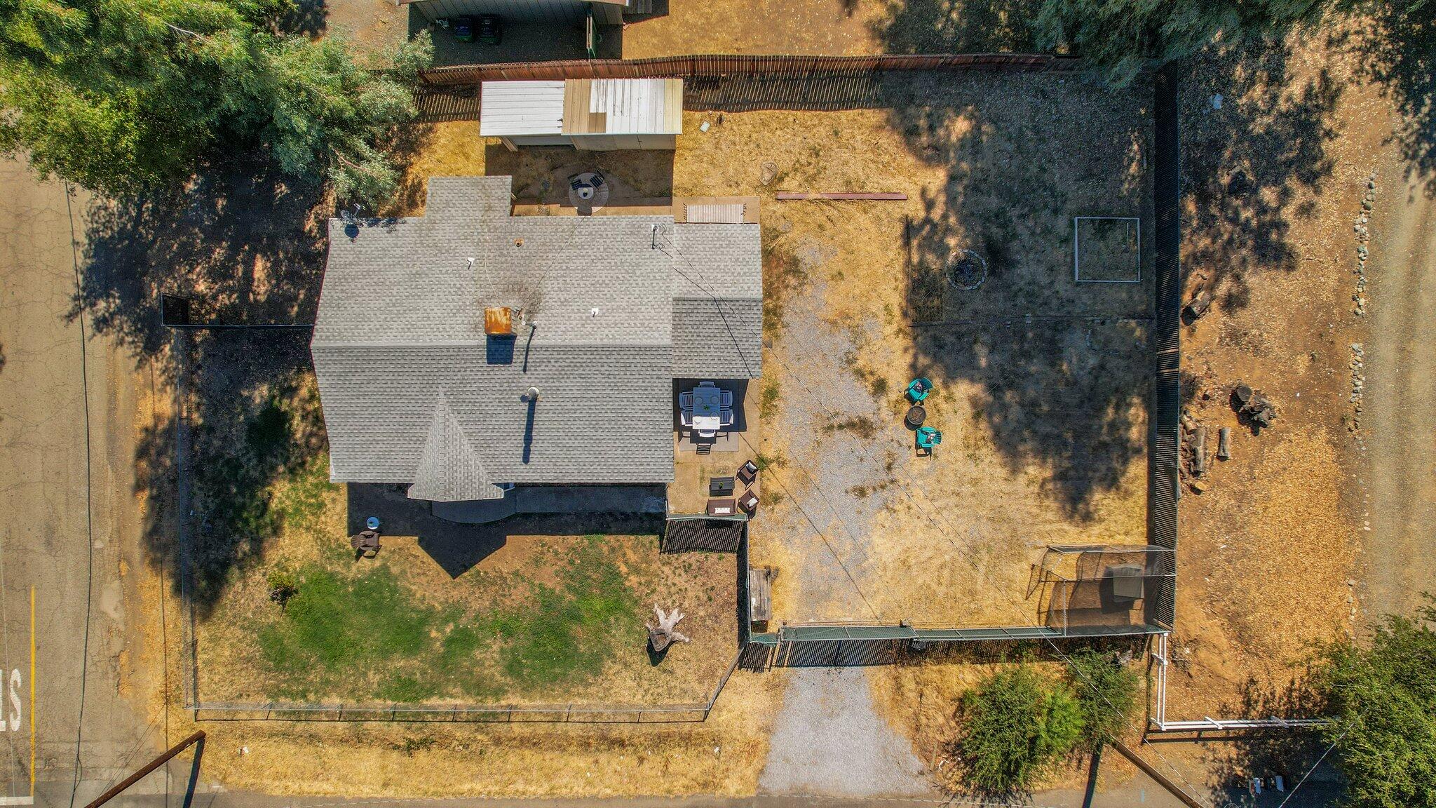 7699 Happy Valley Road Anderson, CA 96007 - Photo 17 of 49 aerial view of a house with a yard
