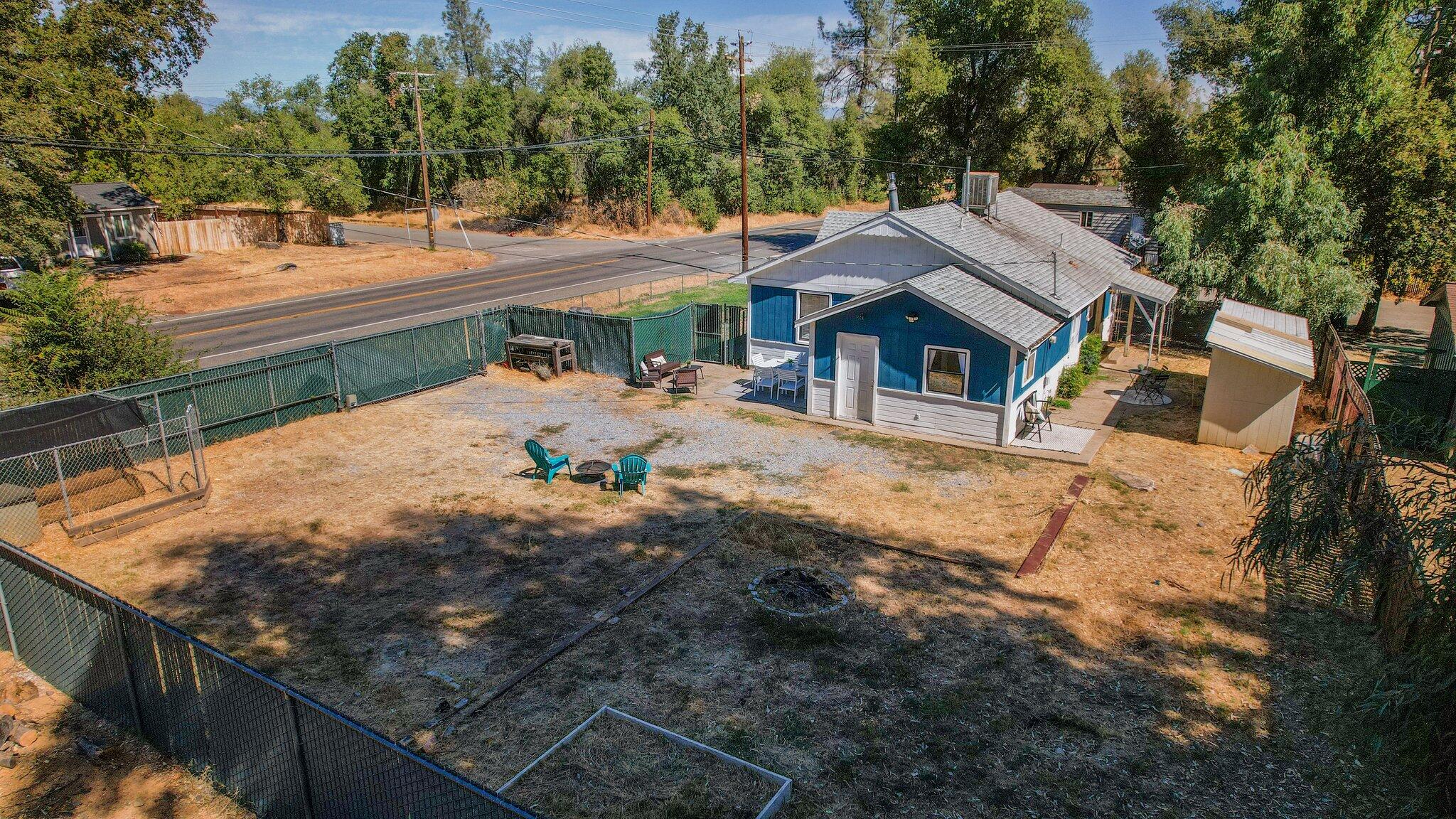 7699 Happy Valley Road Anderson, CA 96007 - Photo 18 of 49 a view of a house with wooden fence