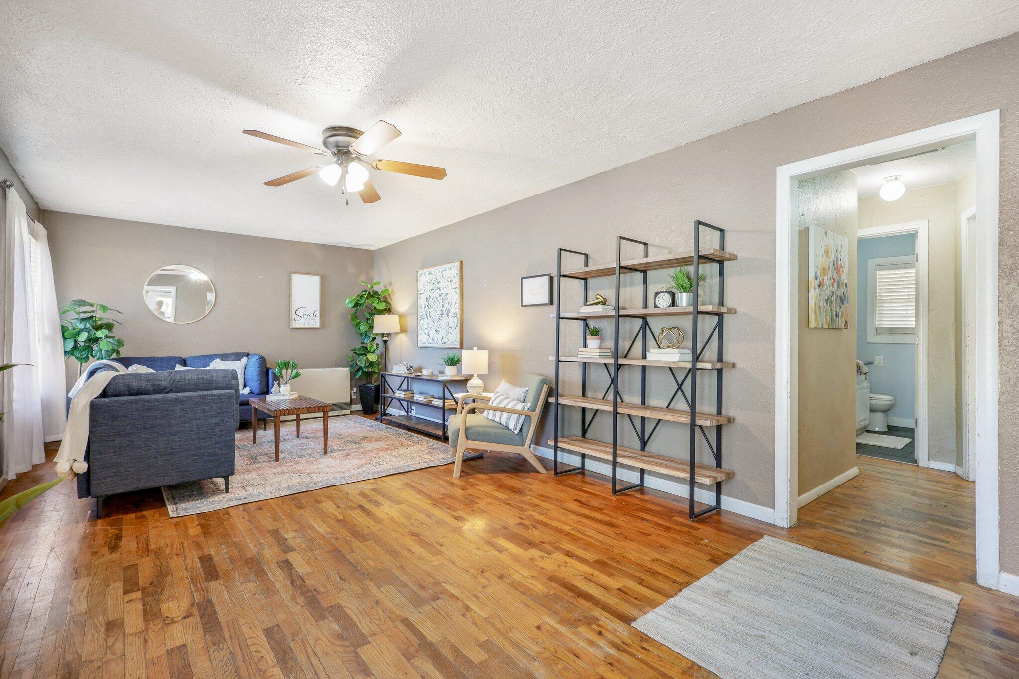 7699 Happy Valley Road Anderson, CA 96007 - Photo 19 of 49 a living room with furniture and wooden floor