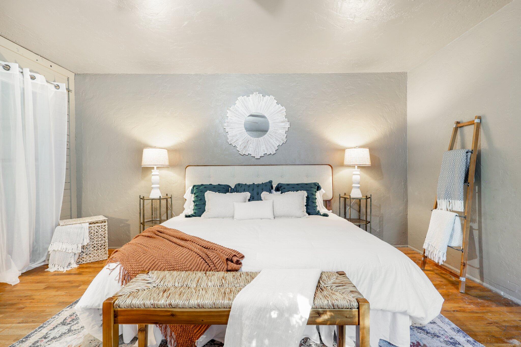 7699 Happy Valley Road Anderson, CA 96007 - Photo 28 of 49 a bedroom with a bed and wooden floor