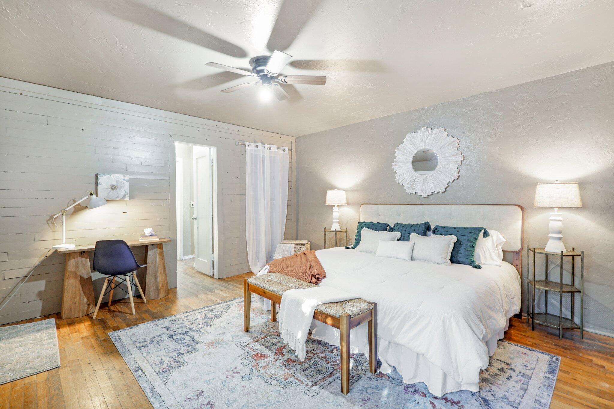7699 Happy Valley Road Anderson, CA 96007 - Photo 29 of 49 a bedroom with a bed a chandelier and closet