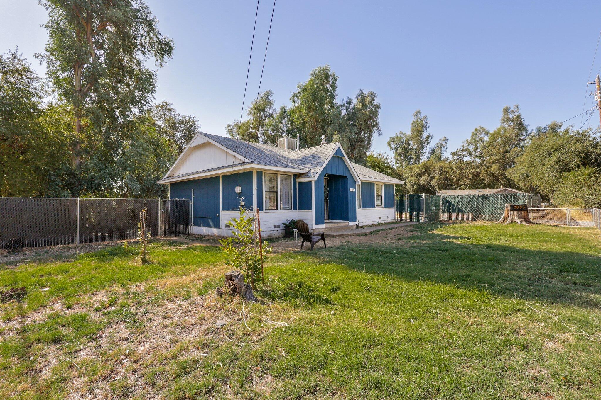 7699 Happy Valley Road Anderson, CA 96007 - Photo 37 of 49 a backyard of a house with table and chairs