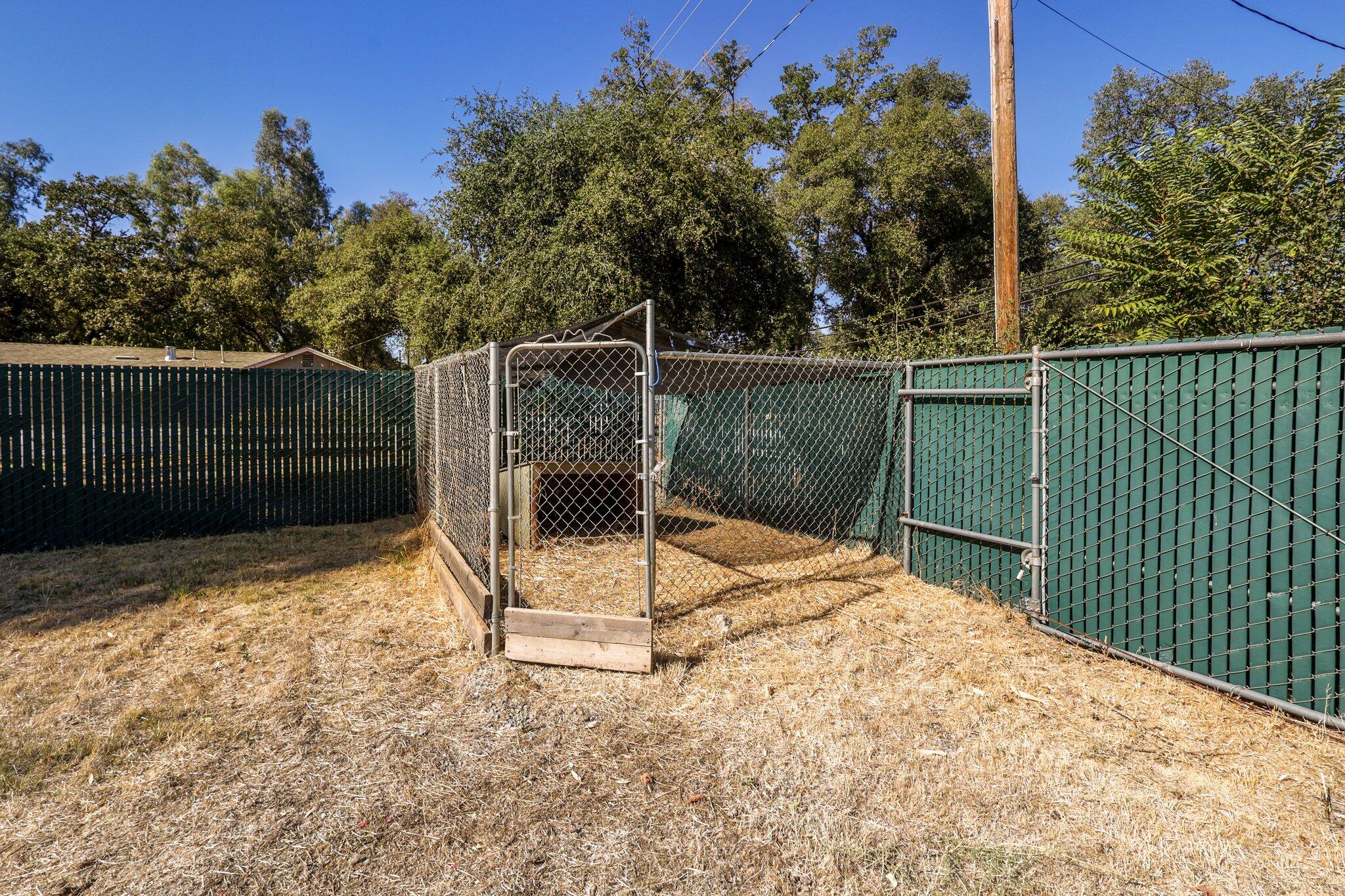 7699 Happy Valley Road Anderson, CA 96007 - Photo 39 of 49 a backyard of a house with table and chairs