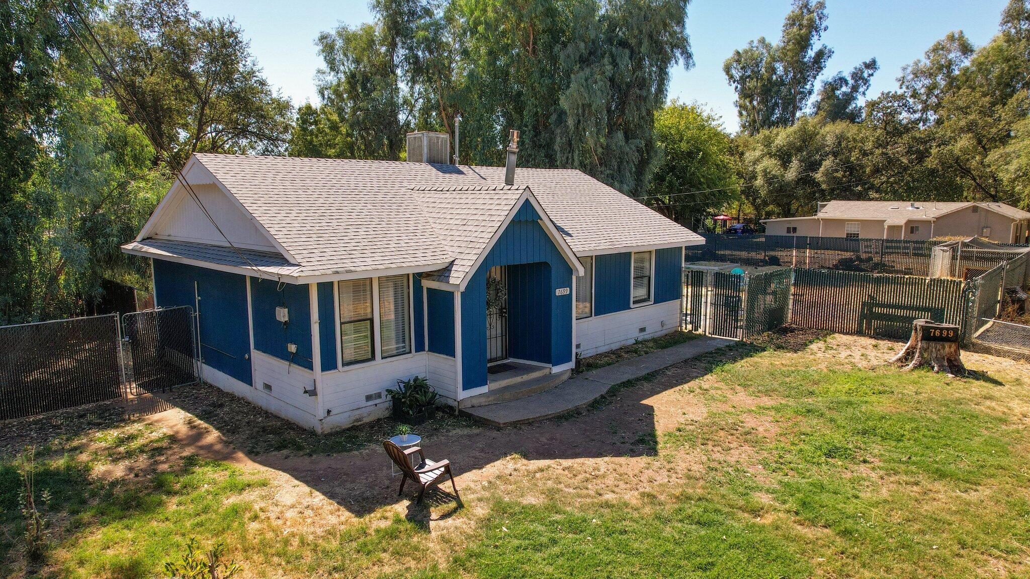 7699 Happy Valley Road Anderson, CA 96007 - Photo 40 of 49 a view of a house with a yard and sitting area