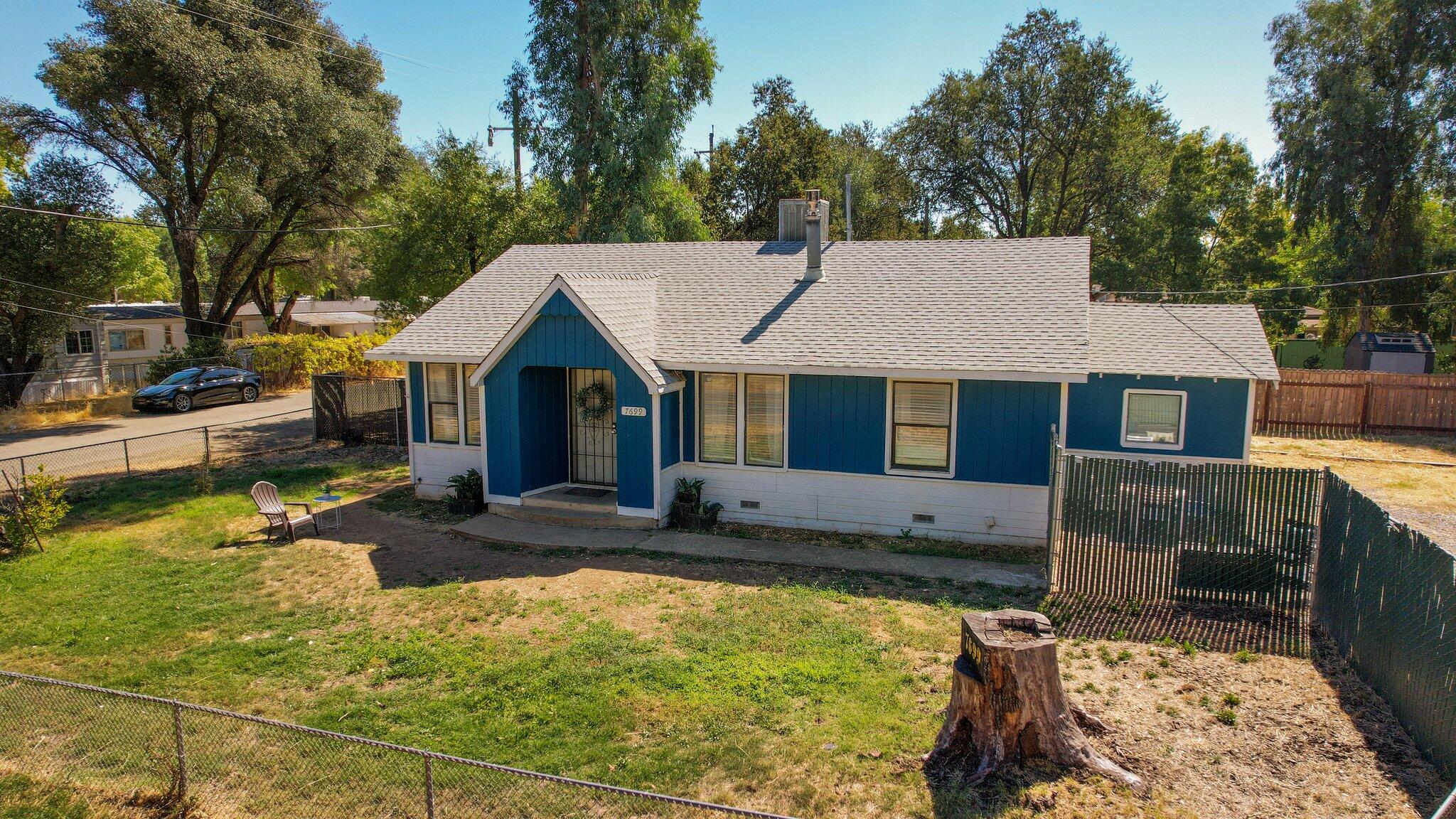 7699 Happy Valley Road Anderson, CA 96007 - Photo 41 of 49 a view of a house with backyard and sitting area
