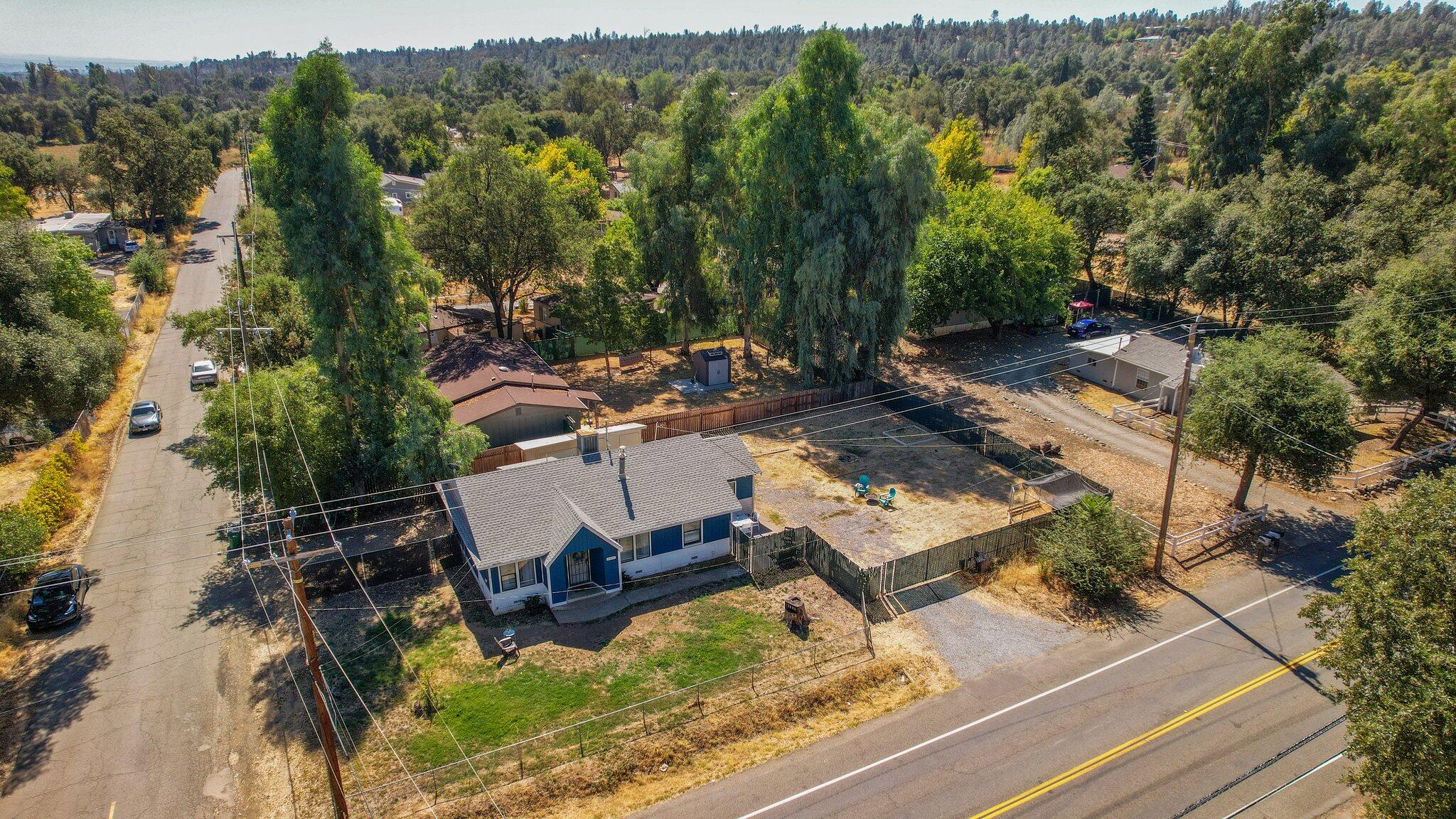 7699 Happy Valley Road Anderson, CA 96007 - Photo 42 of 49 an aerial view of a house with a yard basket ball court and outdoor seating