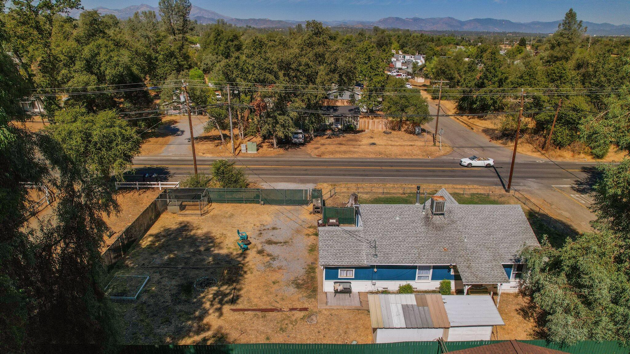 7699 Happy Valley Road Anderson, CA 96007 - Photo 48 of 49 an aerial view of a house with a yard