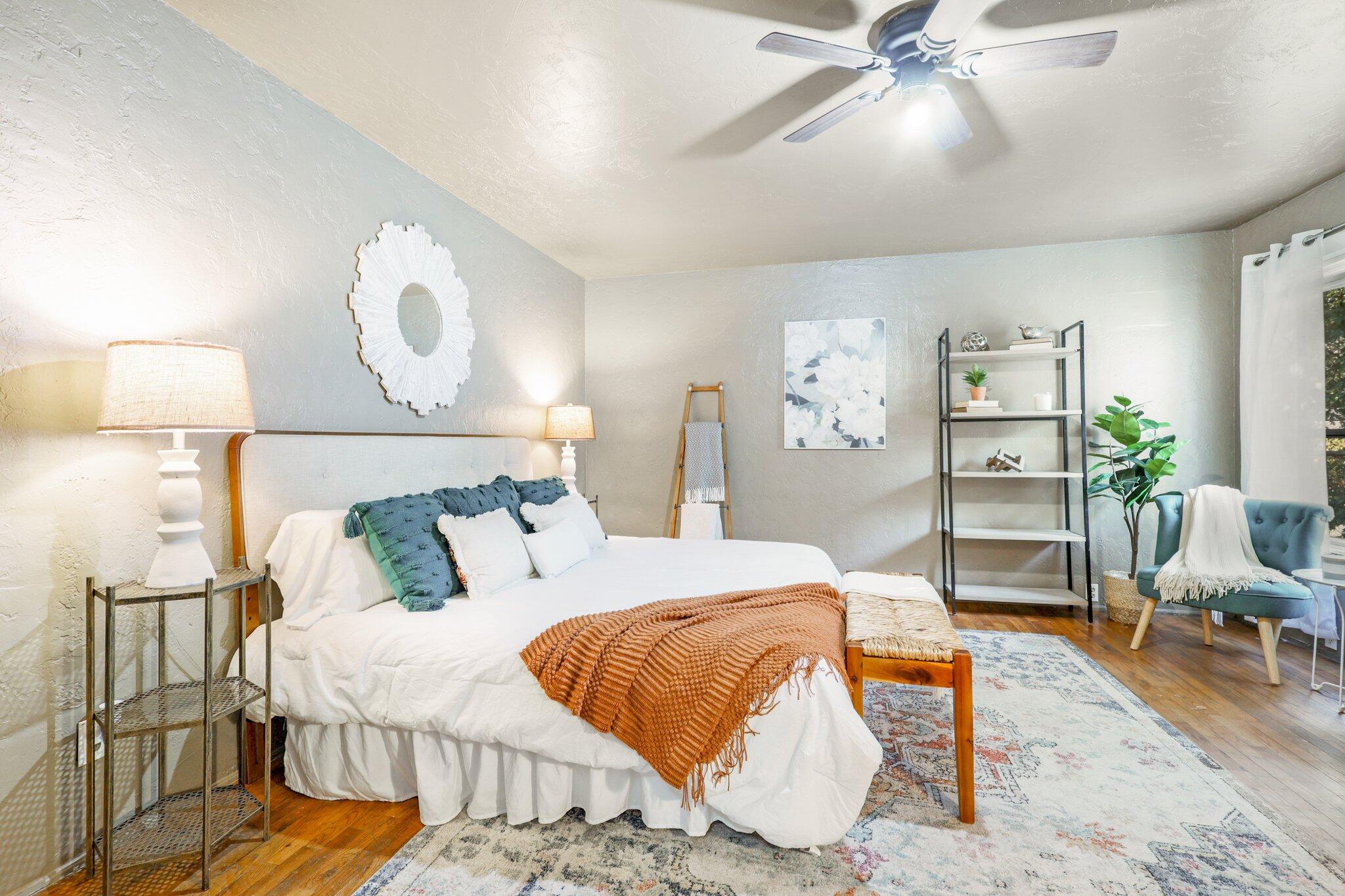 7699 Happy Valley Road Anderson, CA 96007 - Photo 6 of 49 a bedroom with a bed and a chandelier