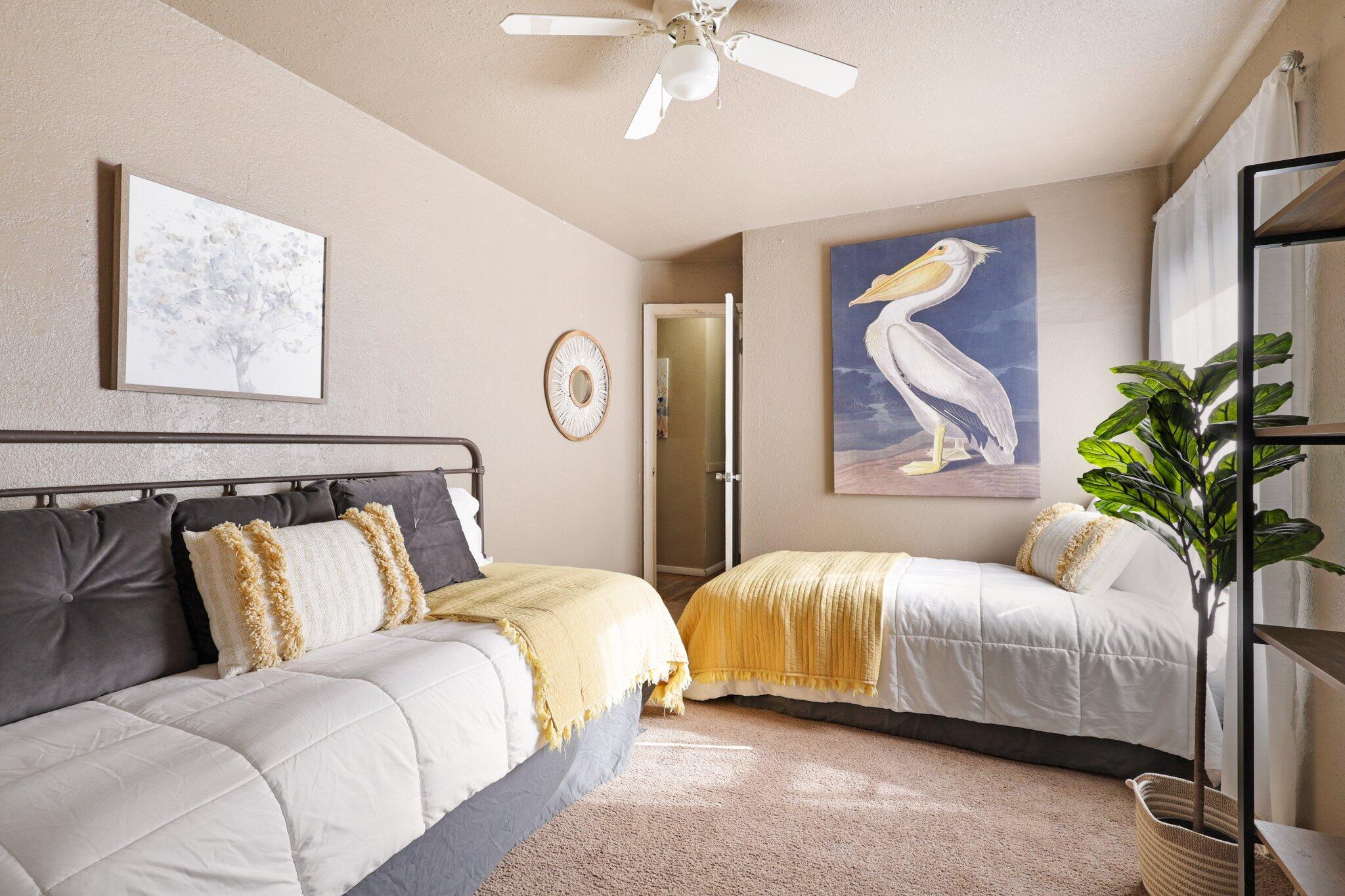 7699 Happy Valley Road Anderson, CA 96007 - Photo 7 of 49 a bedroom with a bed lamp and a potted plant