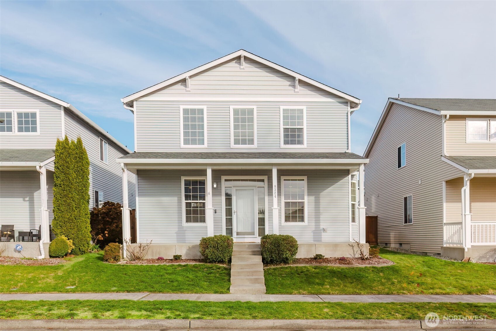 a front view of a house with a yard