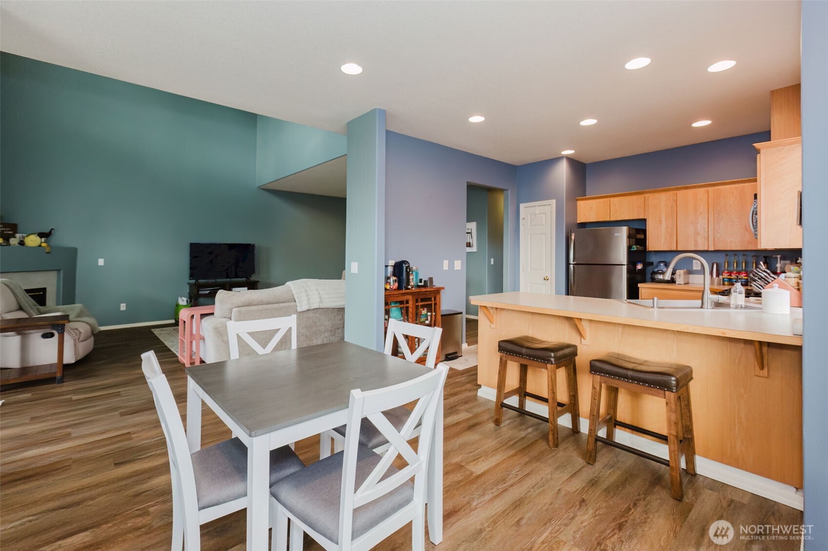 8324 Sweetbrier Loop Southeast Olympia, WA 98513 - Photo 12 of 39 a view of a dining room with furniture and wooden floor