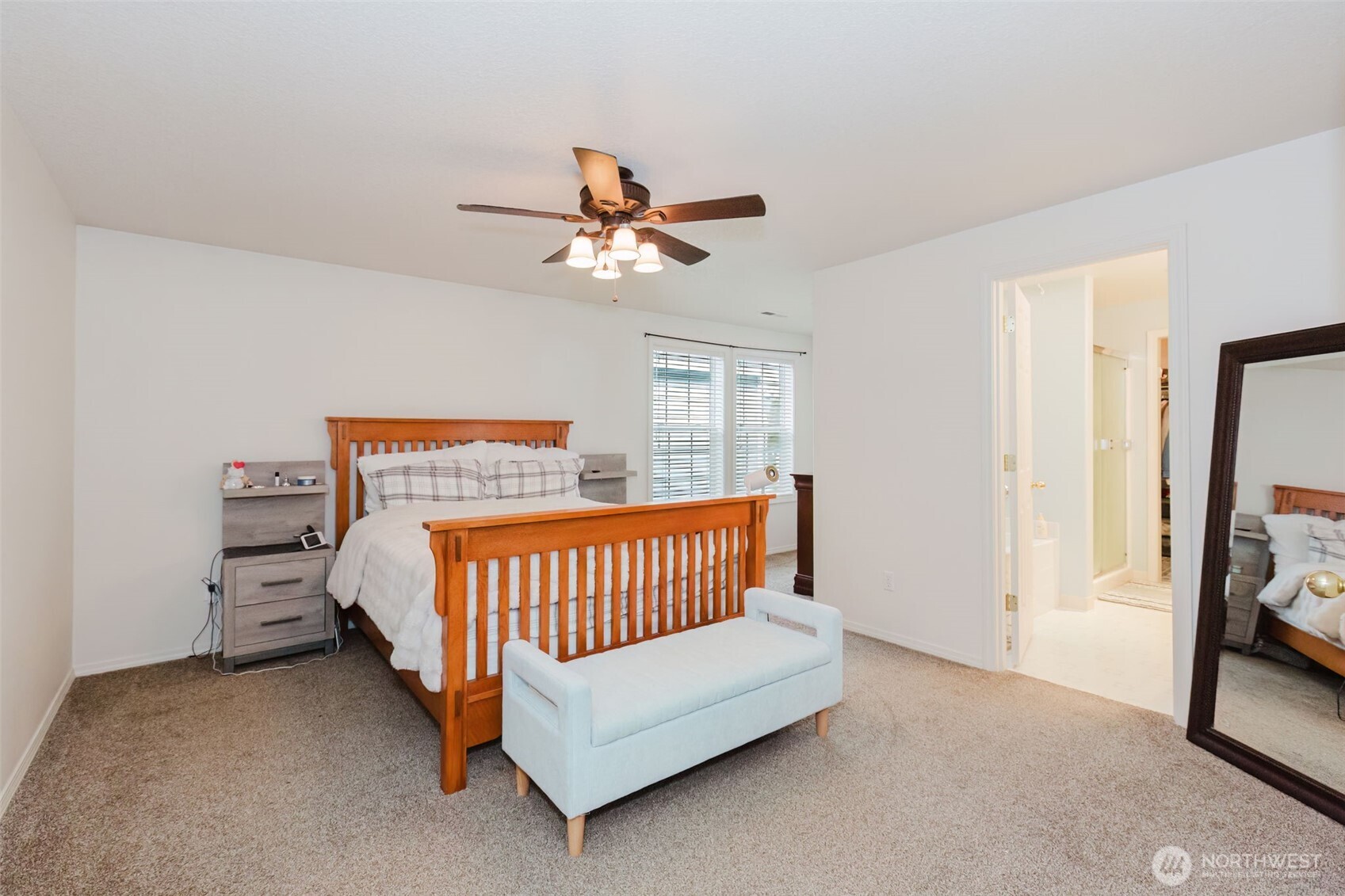 8324 Sweetbrier Loop Southeast Olympia, WA 98513 - Photo 19 of 39 a bedroom with a bed and a chandelier