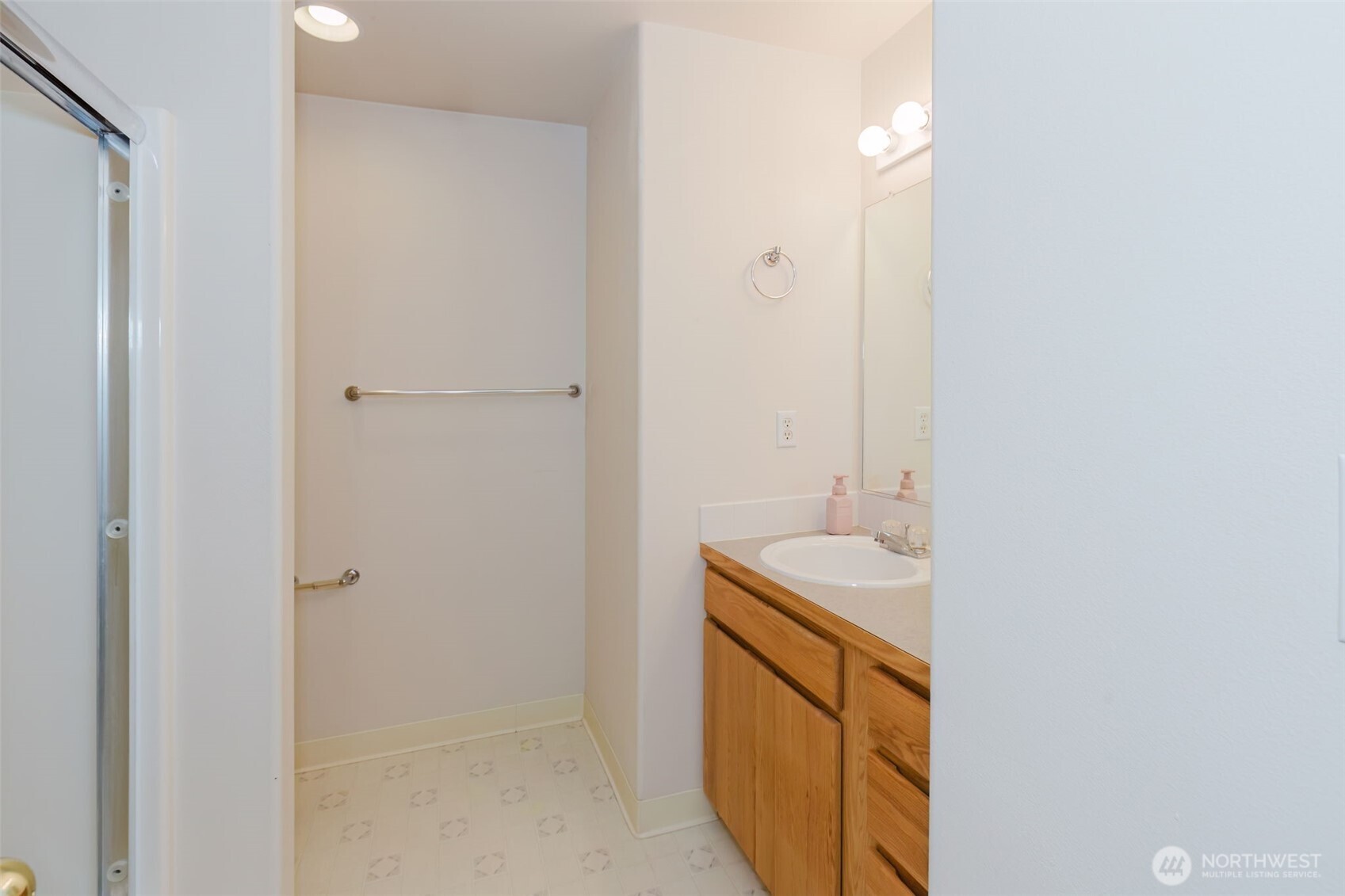 8324 Sweetbrier Loop Southeast Olympia, WA 98513 - Photo 28 of 39 a bathroom with a sink and a mirror