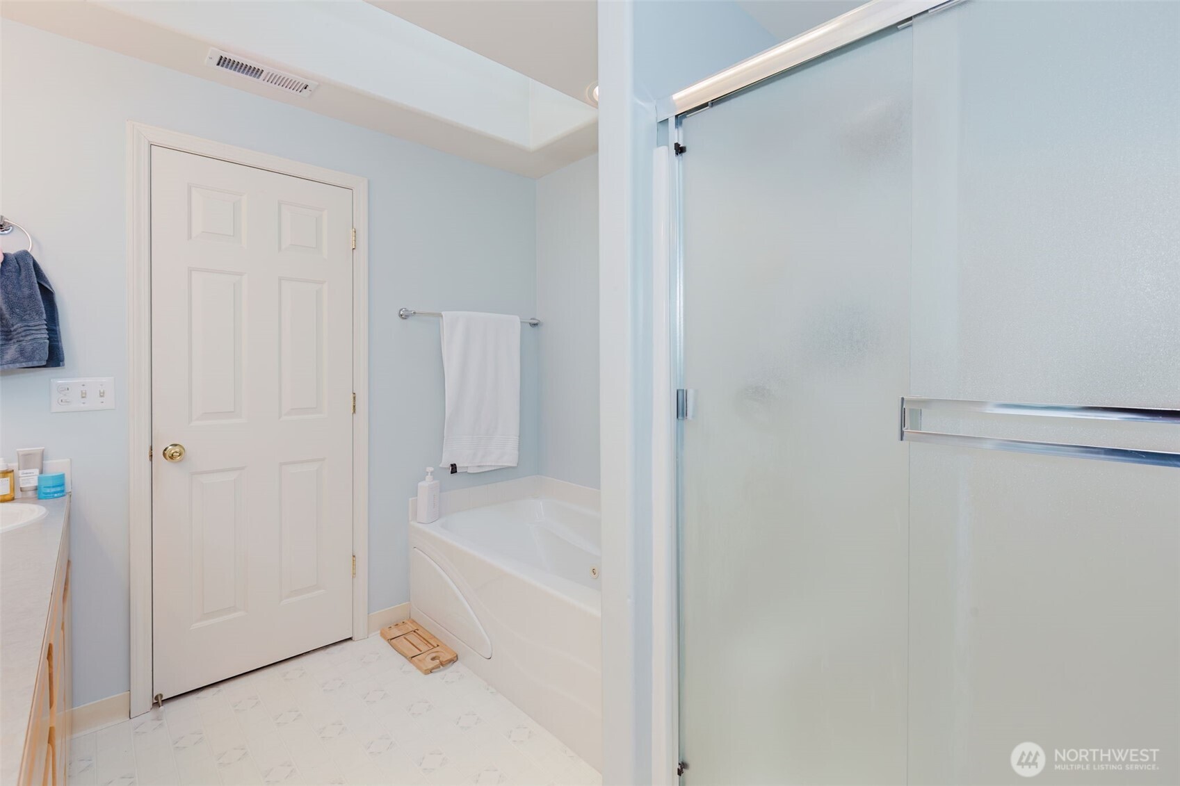 8324 Sweetbrier Loop Southeast Olympia, WA 98513 - Photo 29 of 39 a bathroom with a bathtub and a shower