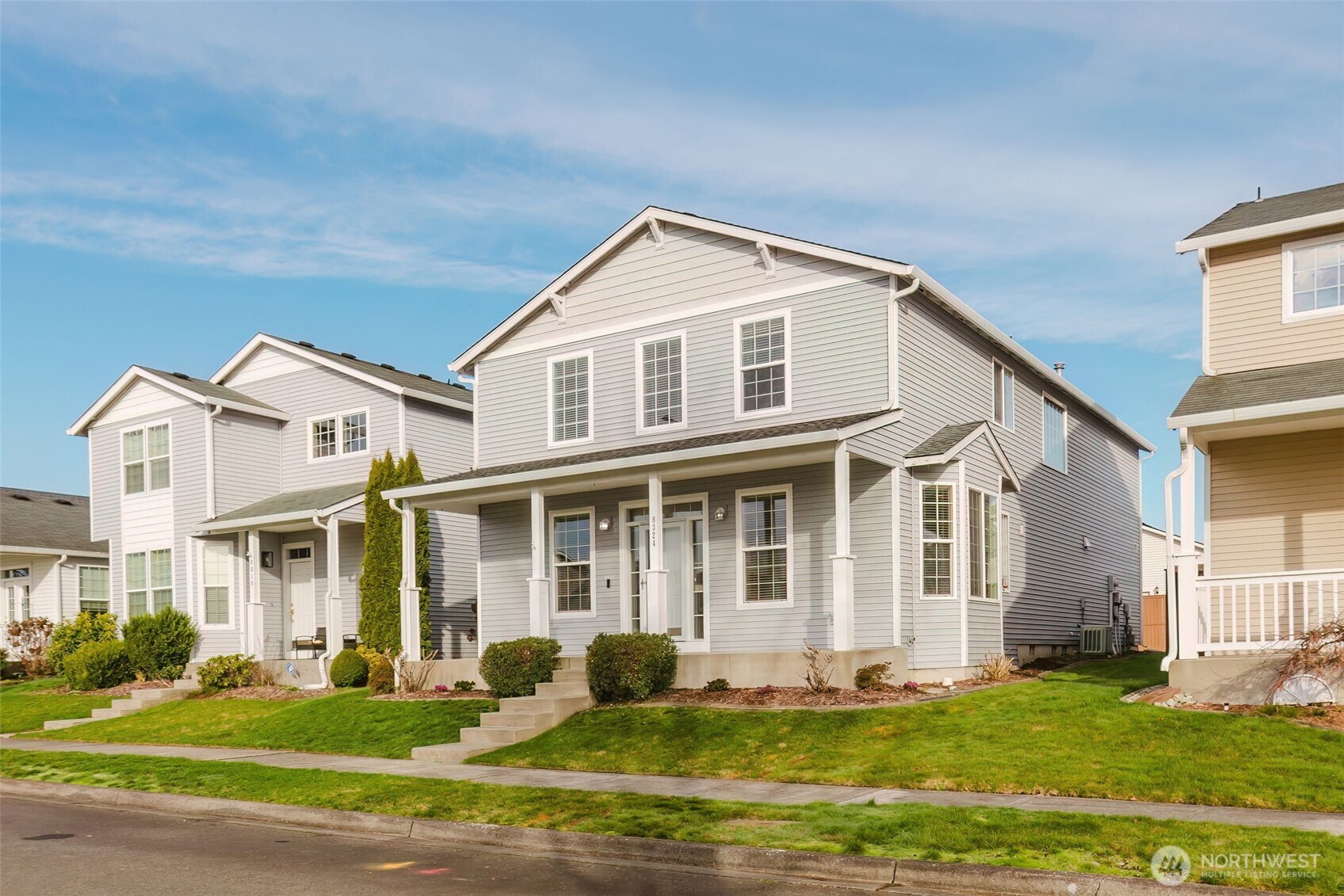 8324 Sweetbrier Loop Southeast Olympia, WA 98513 - Photo 3 of 39 a front view of a house with a yard