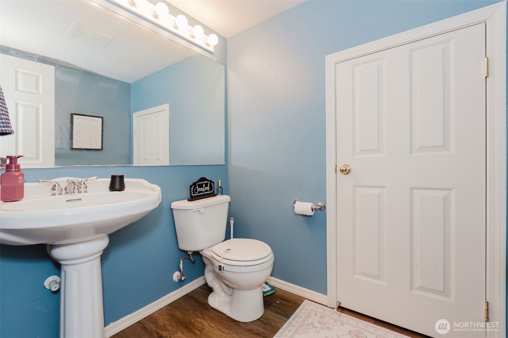 8324 Sweetbrier Loop Southeast Olympia, WA 98513 - Photo 32 of 39 a bathroom with a toilet sink and mirror
