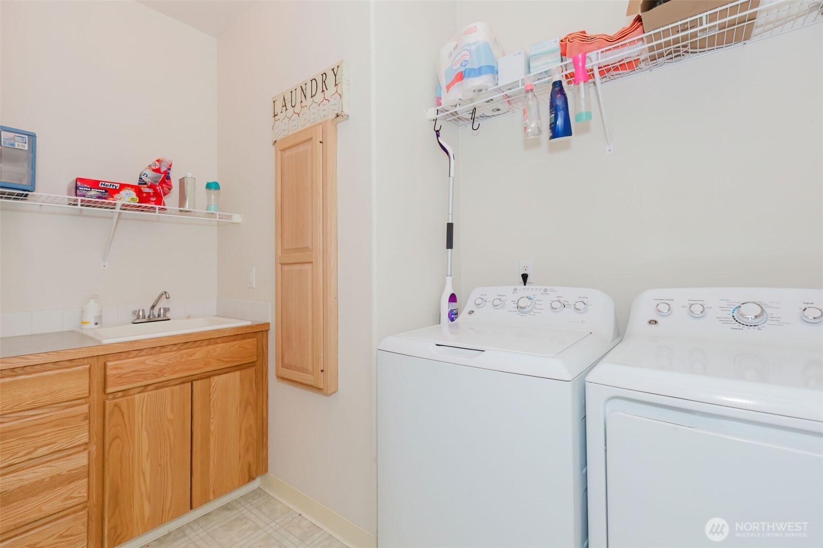 8324 Sweetbrier Loop Southeast Olympia, WA 98513 - Photo 33 of 39 a storage room with a washer and dryer