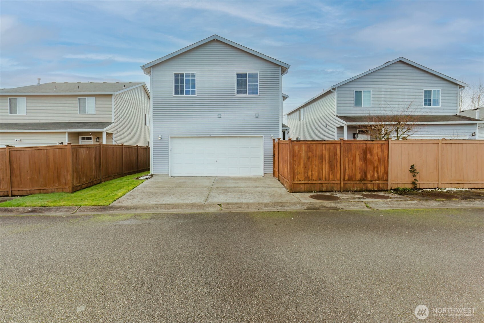 8324 Sweetbrier Loop Southeast Olympia, WA 98513 - Photo 37 of 39 a view of a house with a yard and parking space